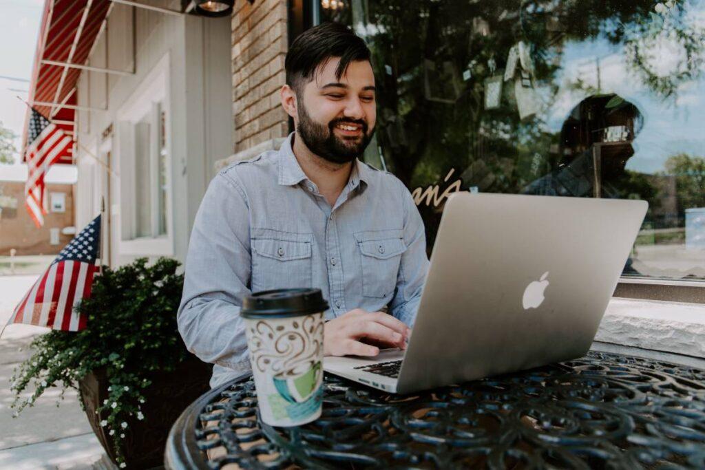 Happy Man using WISP Network on Laptop | ISP Revolution