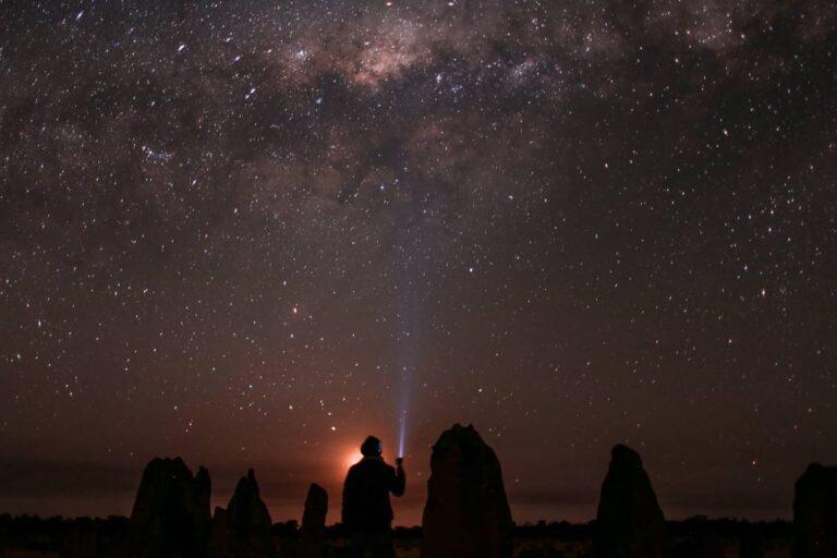 Person stargazing in the clear sky