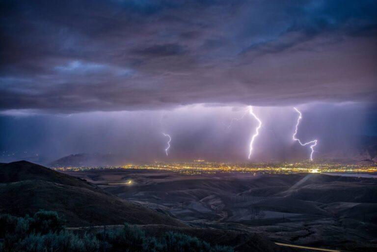 lightning strikes over a city