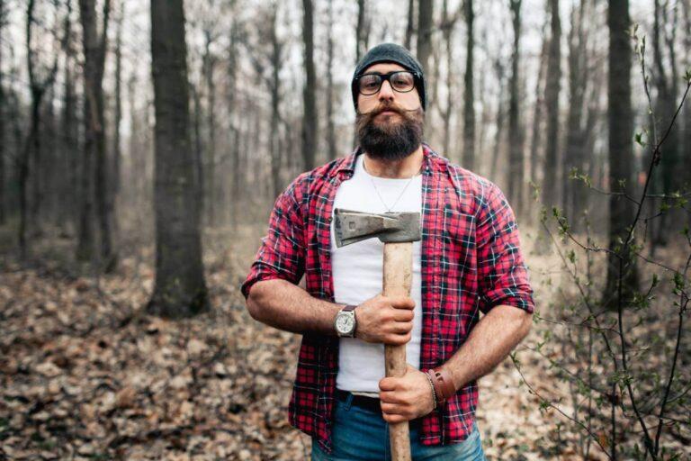 person holding an axe at a lumberjack